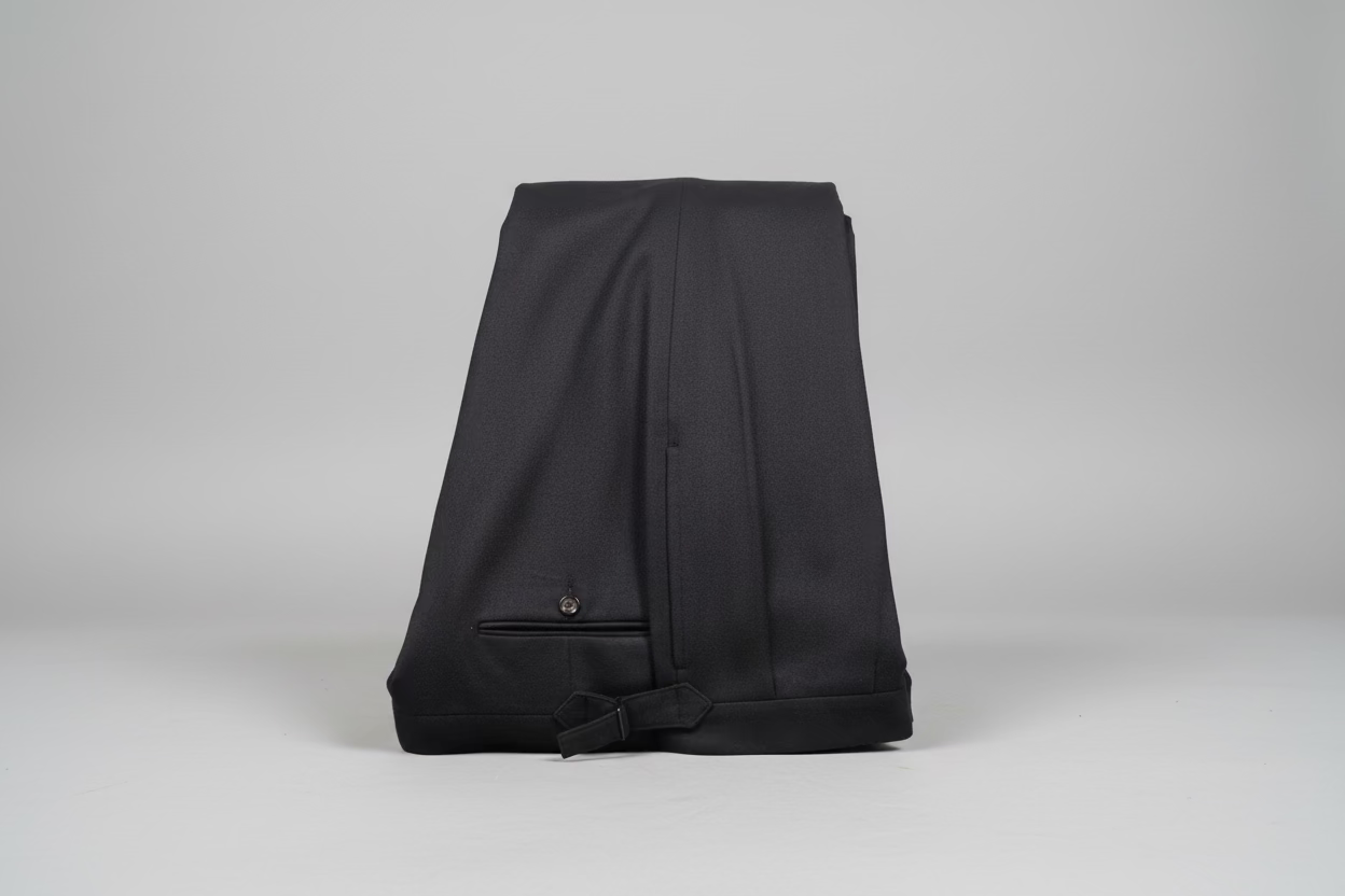 Black blazer with a bow tie on a beige background