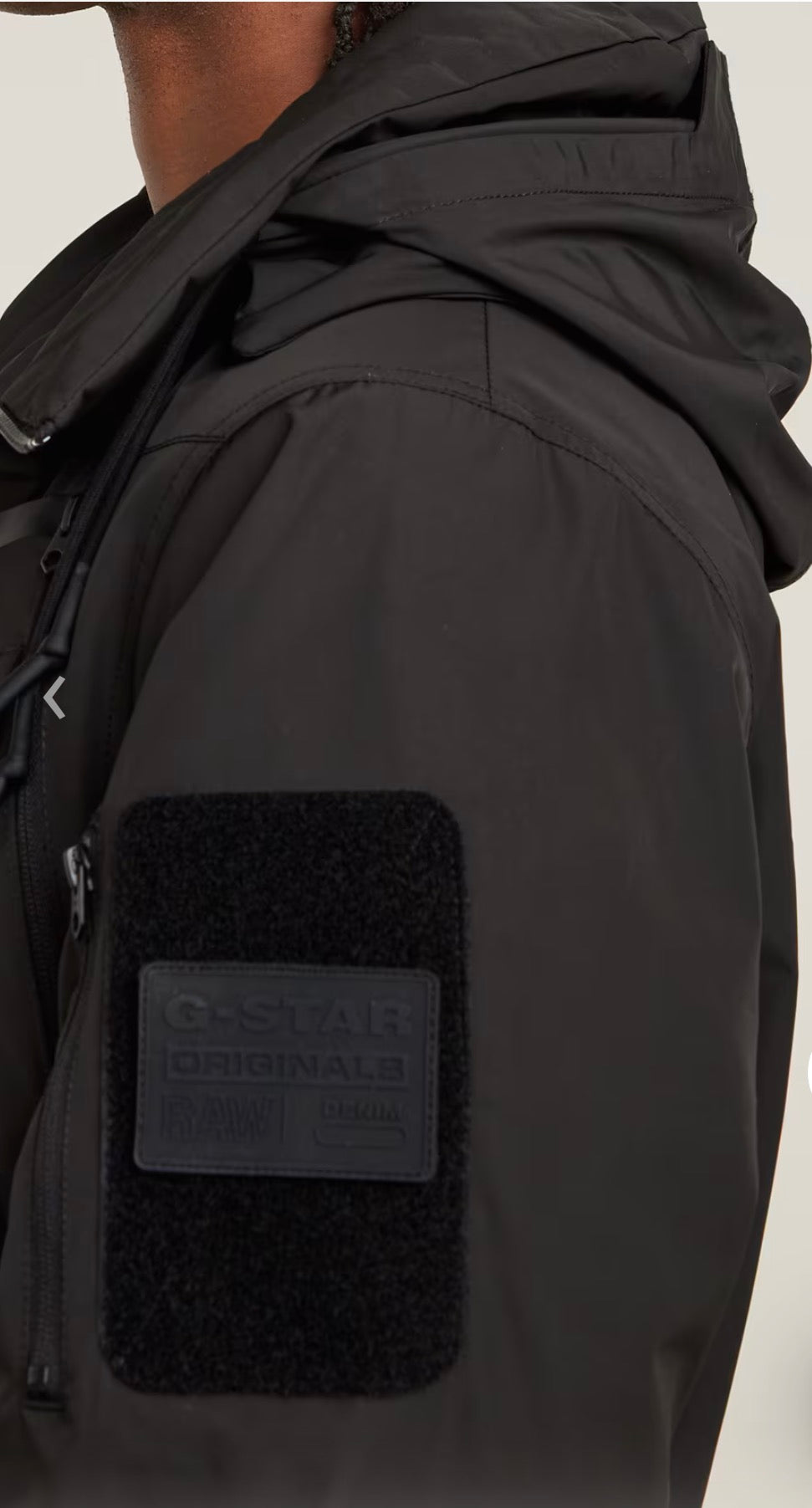 Black jacket with a G-Star Originals patch on a light gray background