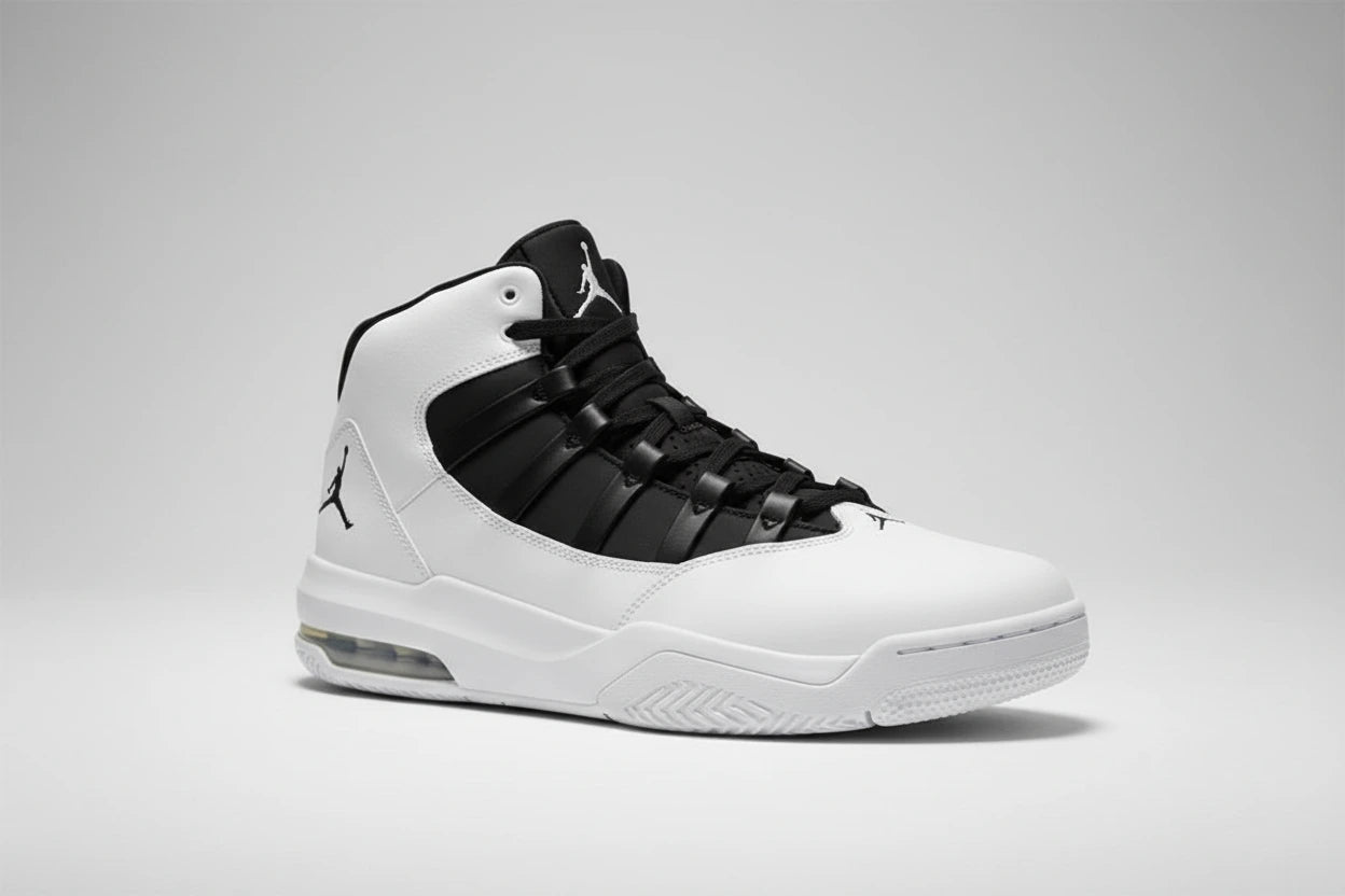 White and black sneaker with Jordan logo on a reflective surface