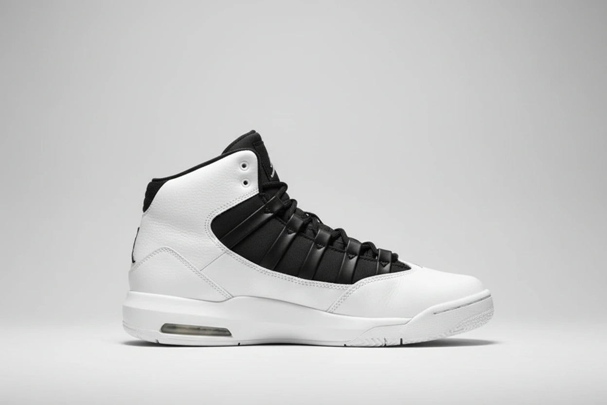 White and black high-top sneakers on a reflective surface