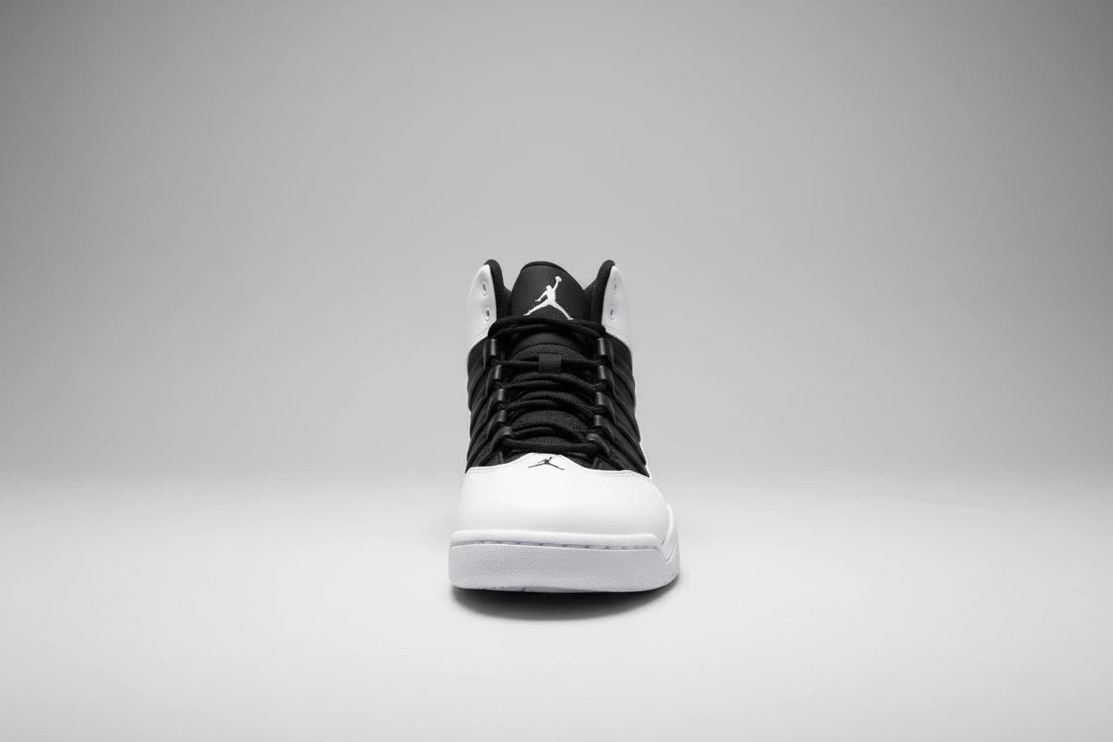 White and black high-top sneakers on a reflective surface