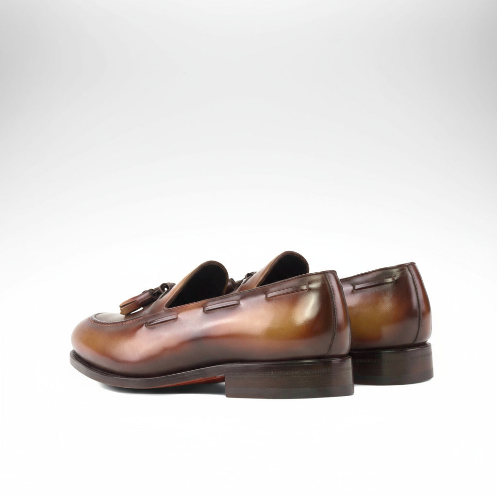 Pair of brown loafers on a white background