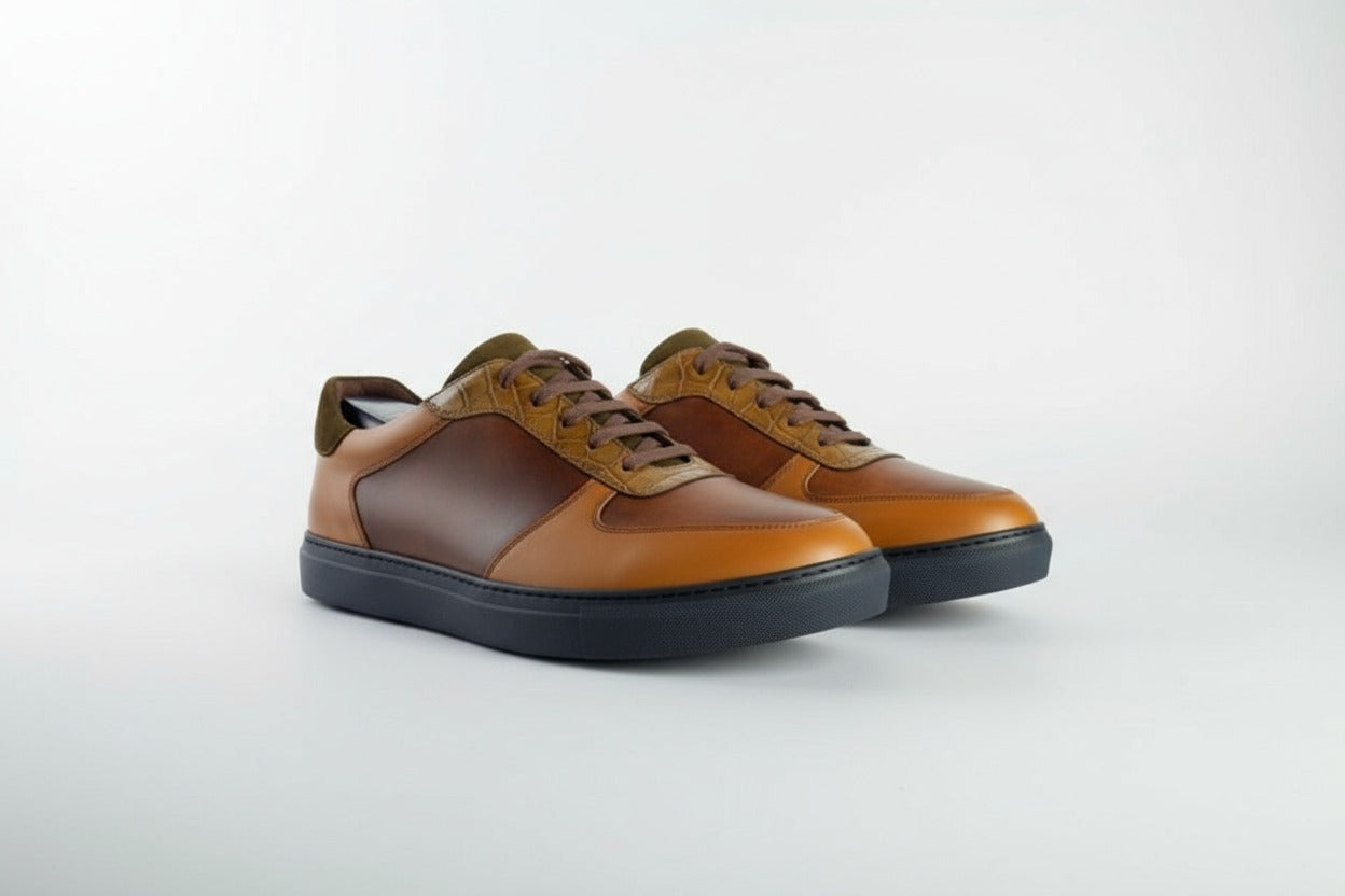 Brown and black leather shoe on a white background