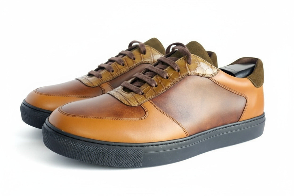 Brown and black leather shoe on a white background