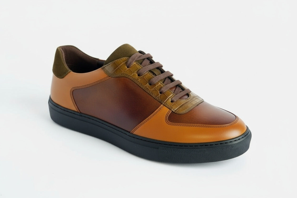 Brown and yellow leather shoe on a white background