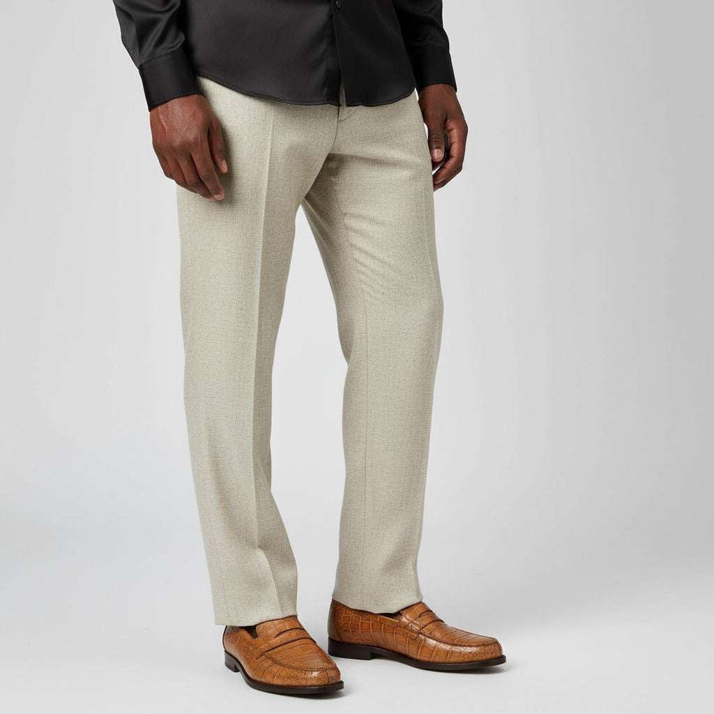 Pair of brown crocodile-textured loafers on a gray background