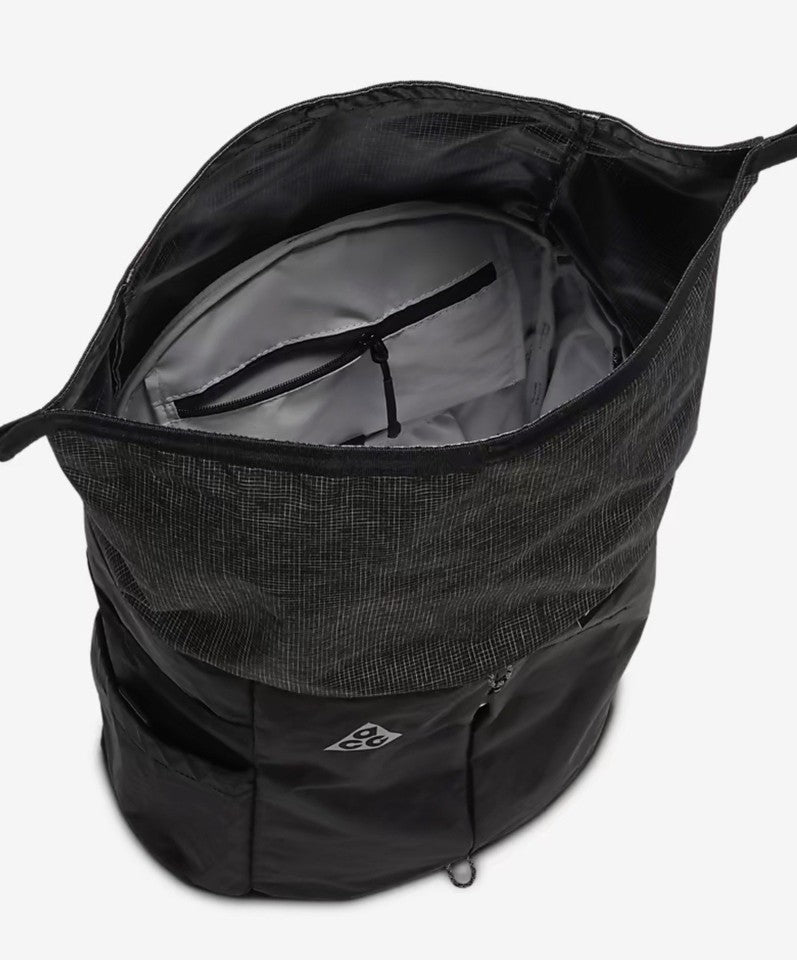 Black backpack with a visible brand logo on a white background