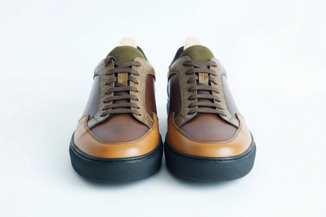 Brown and green leather sneaker on a white background